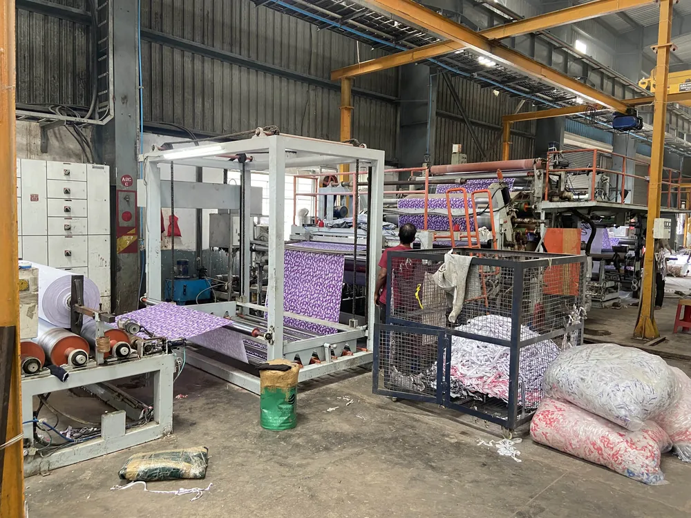 Laminated PVC film being processed on the lamination unit